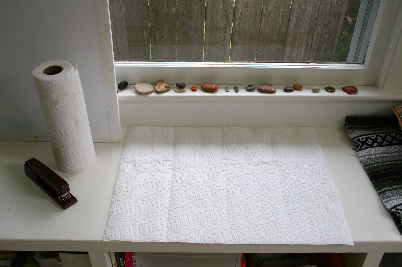 A two-foot-long length of paper towel rolled out onto a table